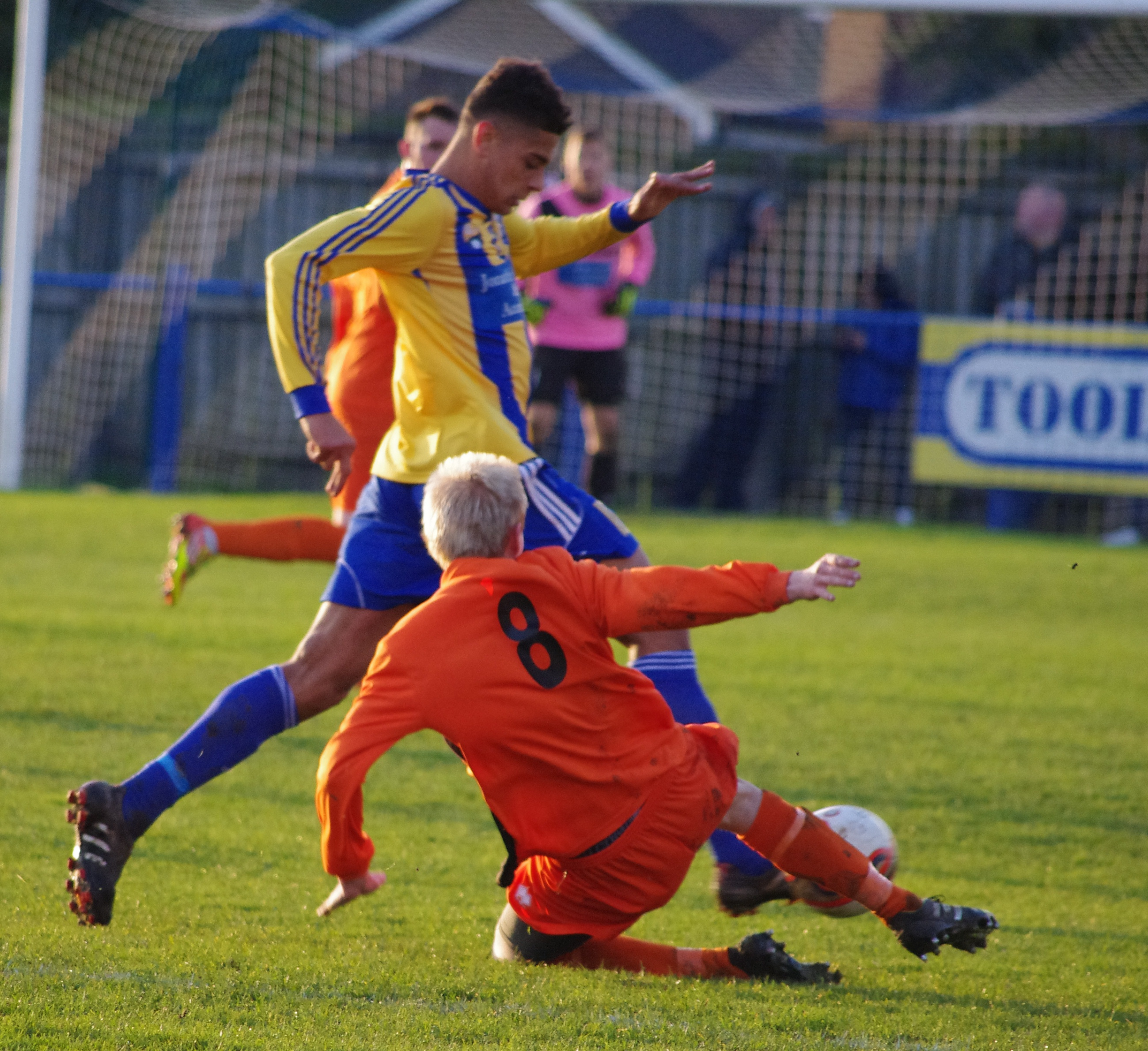 Josh Greenhalgh avoids the tackle from Craig Aspinall