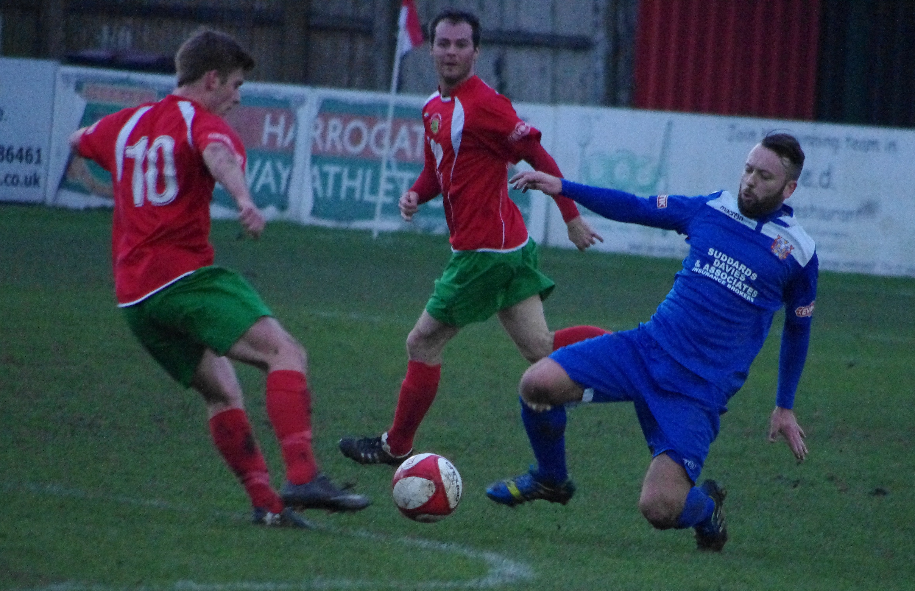 Alex Metcalfe tries to get past Farsley's Aaron Hardy