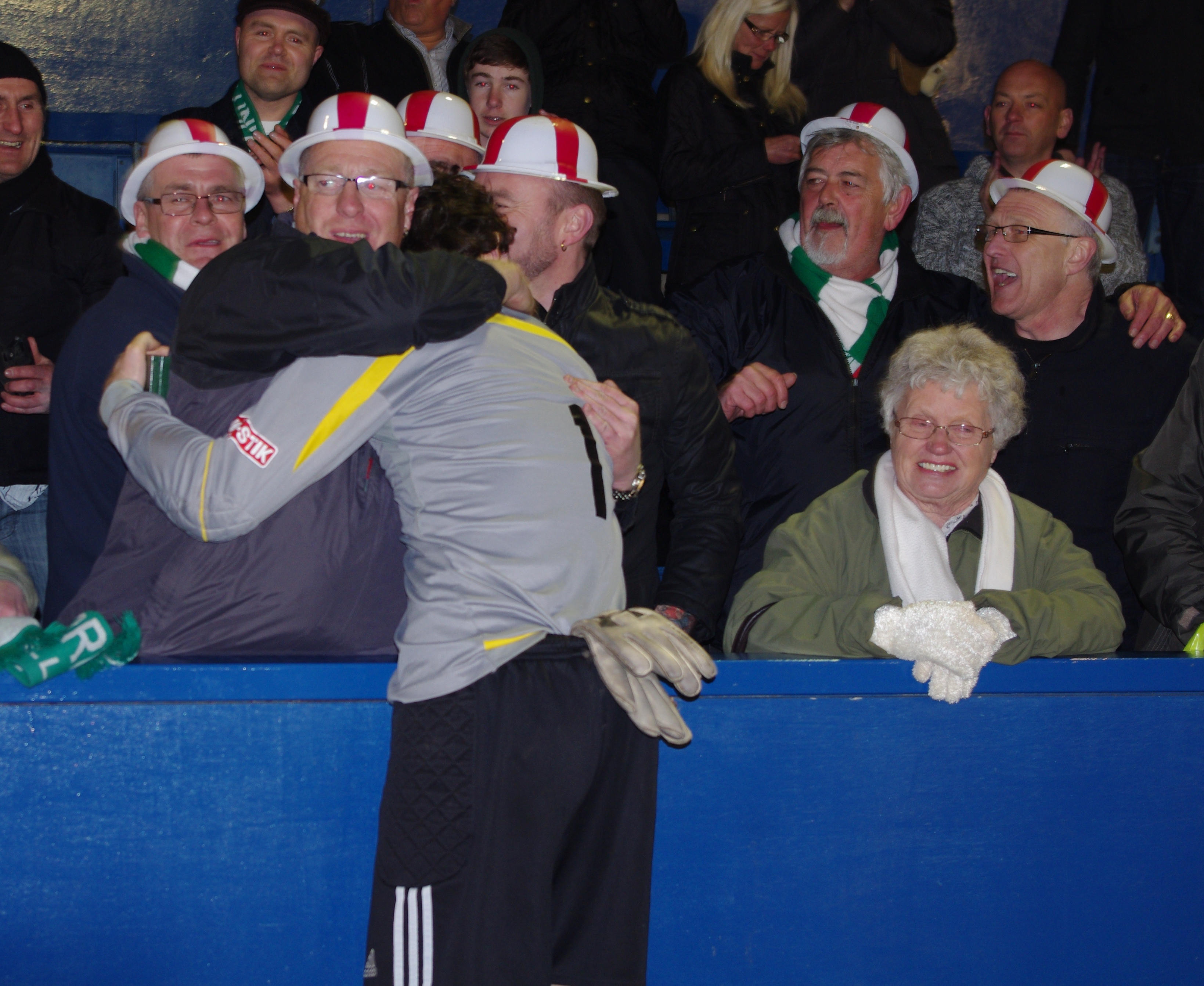 Antoni Pecora celebrates with the North Ferriby fans after their Doodson Sport Cup triumph
