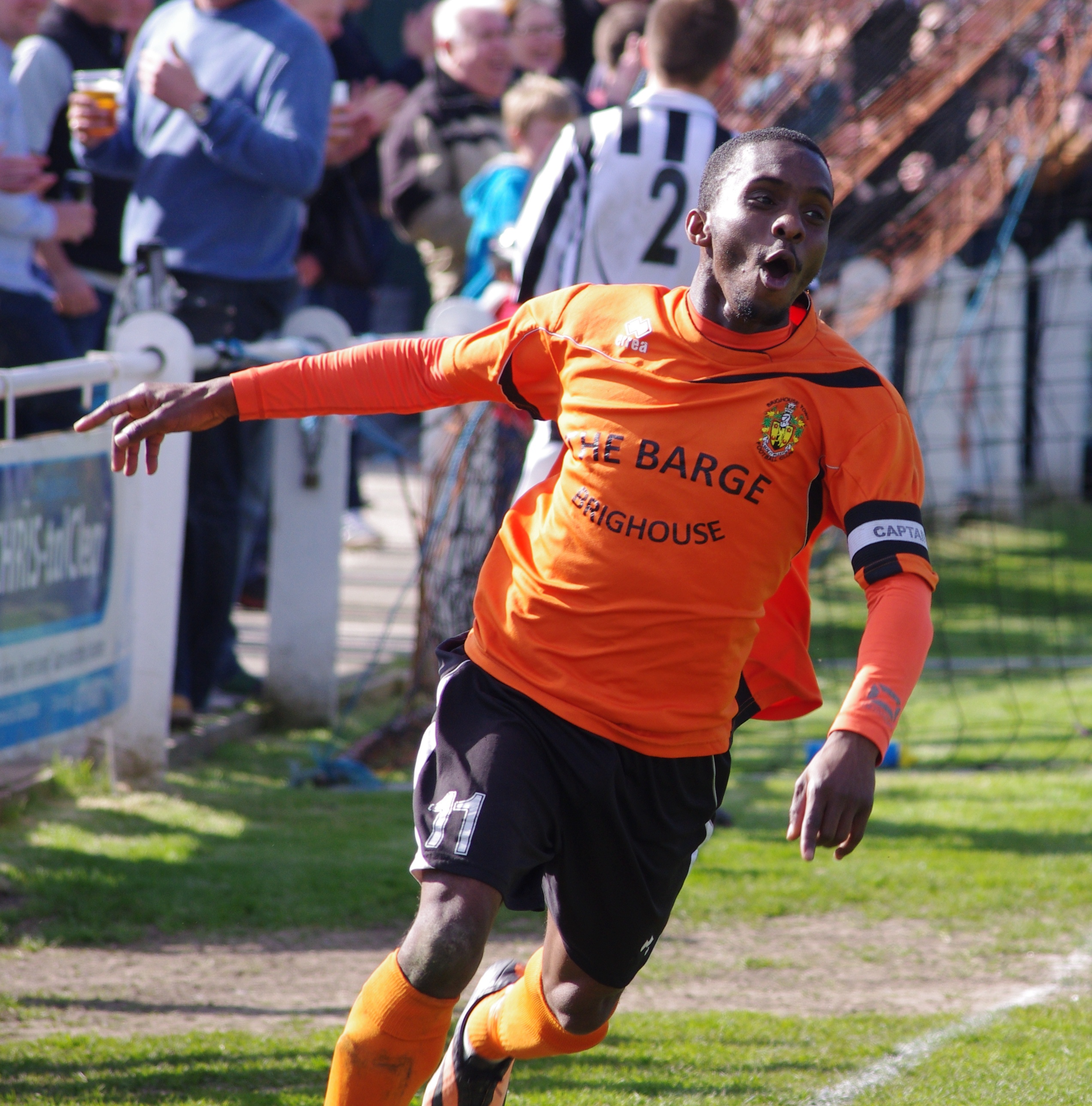 Brighouse Town captain Leon Henry celebrates scoring the decisive goal in their title-winning 2-0 win over Retford United