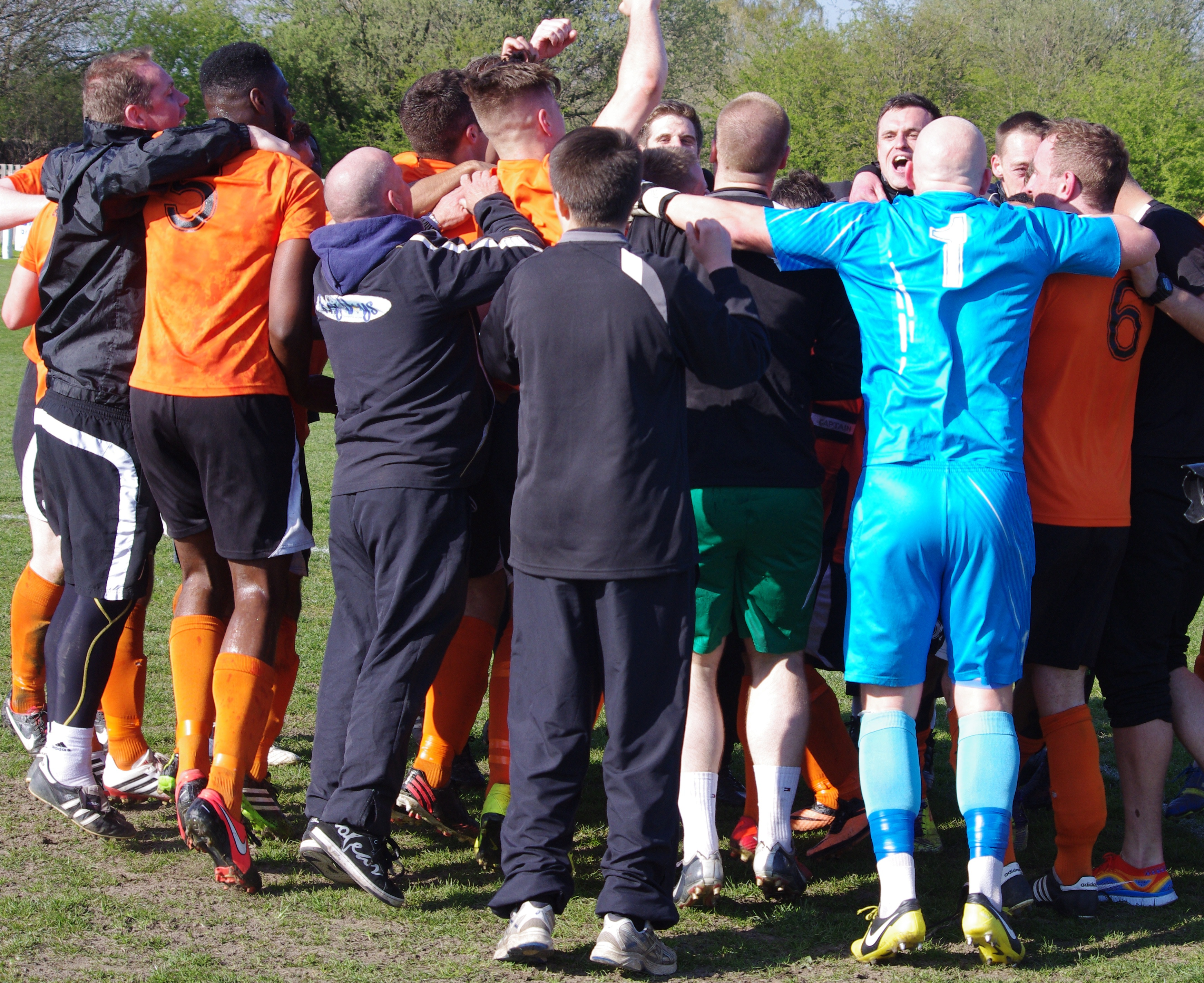 Brighouse player gather for a huddle after winning the Toolstation NCEL Premier Division title