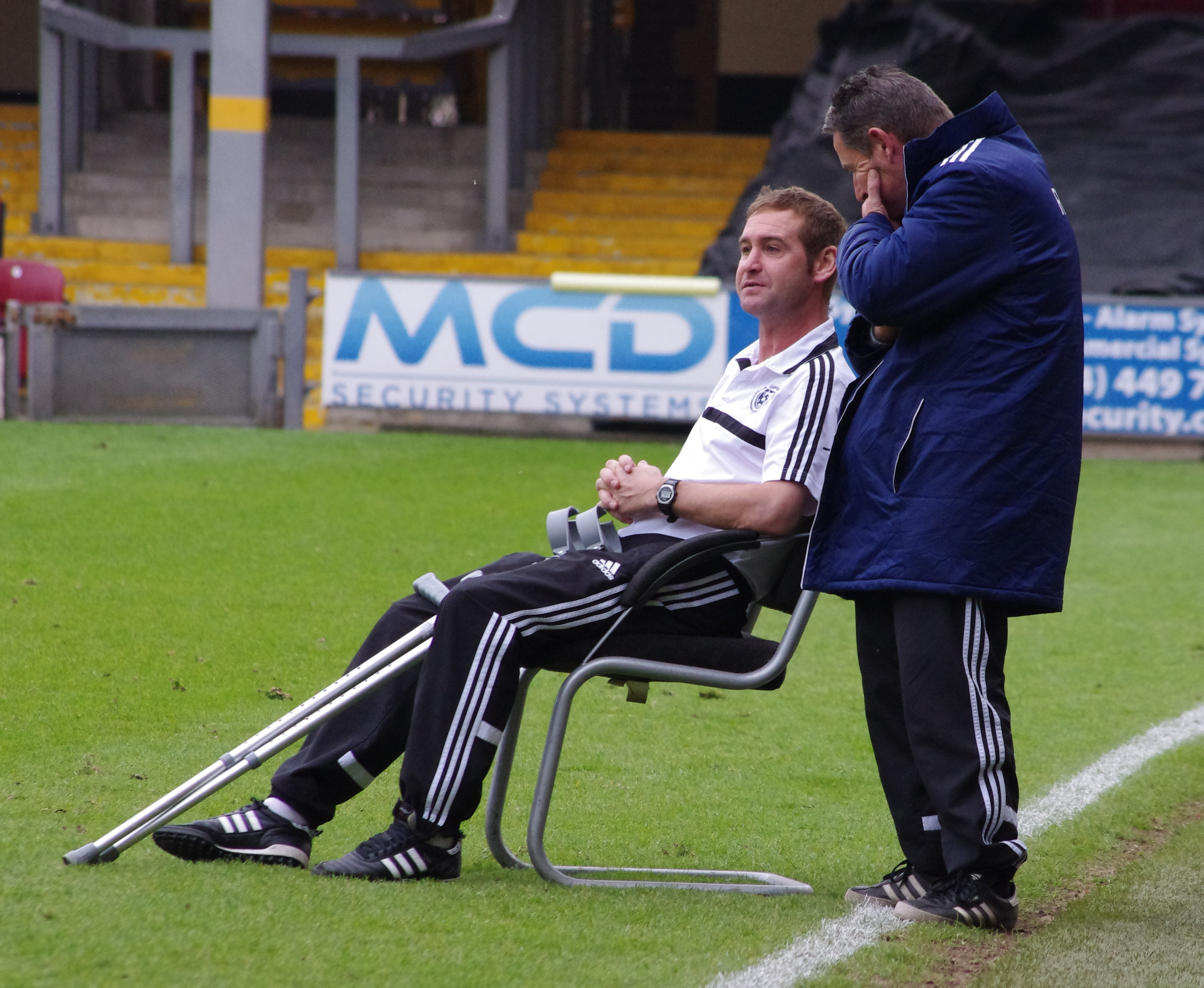Side-lined Eccleshill United head coach Lee Duxbury watches the penalty shootout which Knaresborough Town won 4-2 to win the Toolstation NCEL League Cup final