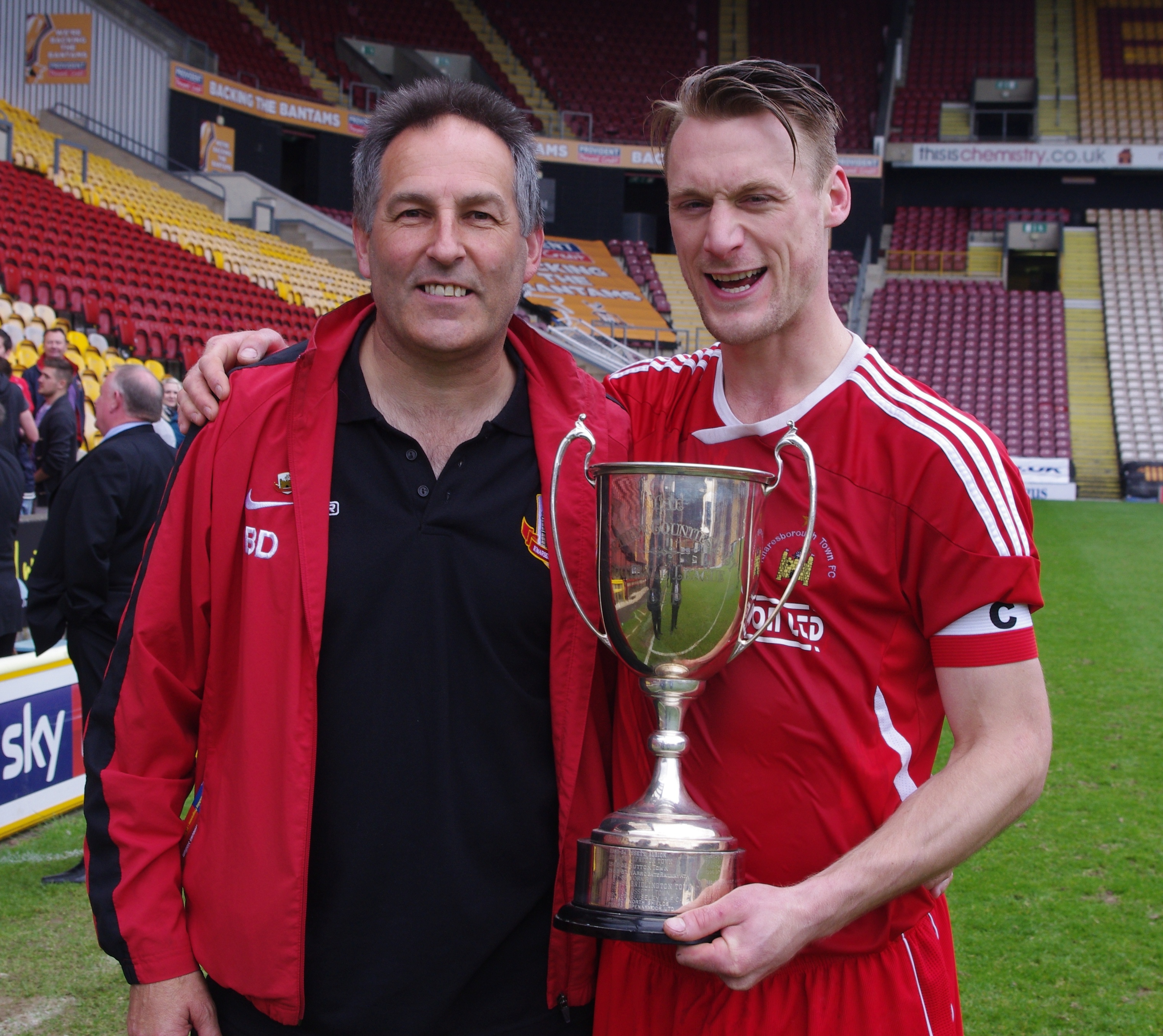 Ambitious Knaresborough Town manager Brian Davey and his captain Matt Duerden with the NCEL League Cup trophy