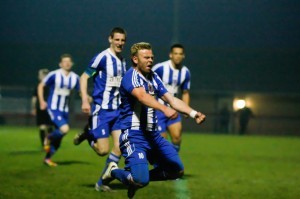 Shaw Lane striker Danny Frost leaps through the air after scoring against Knaresborough to help guide his side to promotion in 2014. Photo: White Rose Photos