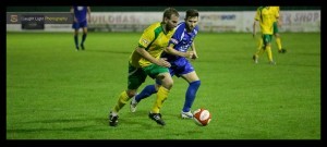 Brighouse midfielder Martin Allison is tracked by Harrogate captain Jason Mycoe. Photo: Caught Light Photography