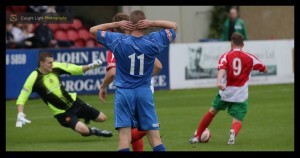 Nathan Cartman rounds Clitheroe's goalkeeper to seal Harrogate Railway's passage into the FA Cup second qualifying round