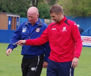 Farsley manager Neil Parsley and his assistant Mark Jackson discuss the first half