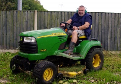 Match Secretary-treasurer Roy Winfield cutting the grass at the Crofton Community Centre