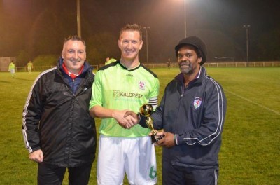 AFC Emley captain Paul Sykes being presented with a memento to commerate his 900th career game, alongside Darren Hepworth and Yorkshire Amateur chairman Lincoln Richards. Picture: Rob Dixon (Twitter) 