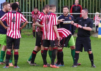 Referee Paul Tomes to produce his red card