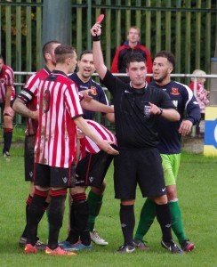 Referee Paul Tomes sends Worsbrough striker Brad Kerr off while Selby's Nathan Kamara watches on in the 1-1 draw