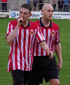 Kerr being escorted off by Worsbrough team-mate Andrew Taylor