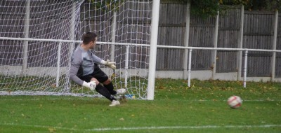 Ben Saynor is sent the wrong for Parkgate's Ross Shelton's penalty