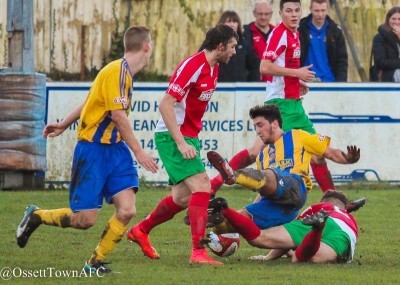 Ossett midfielder Sam Akeroyd is taken out by a challenge from Fatlum Ibrahimi