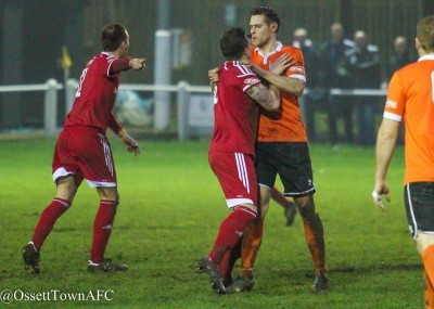 James Hurtley appears to grab Ossett Town attacker Ryan Williams by the throat. Picture: Mark Gledhill