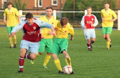 AFC Emley defender Anthony Leech battles for the ball