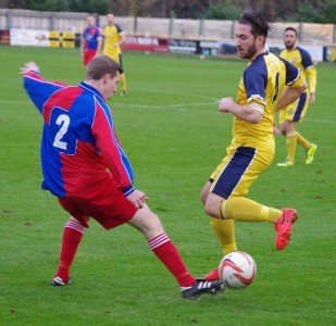 Josh Greening takes on Morpeth's Shaun Henderson