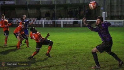 Brighouse Town goalkeeper Jack Cookson watches as Adam Baker's wonder strike flies into the top corner