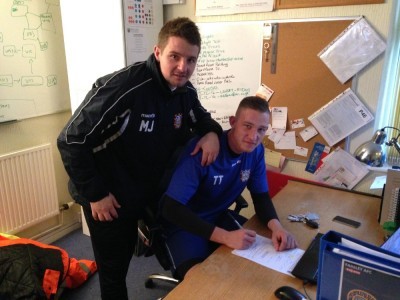 Tom Taylor (right) with Farsley AFC assistant manager Mark Jackson after signing his contract