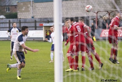Both sets of players watch Liam Ormsby's free kick head towards goal to put Tadcaster in front