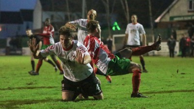 Cartman goes down for the penalty after a poor challenge from Martyn Andrews