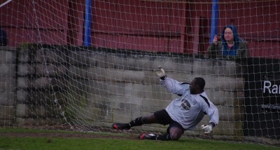Bojang watches as Leonard's penalty goes past his right-hand post