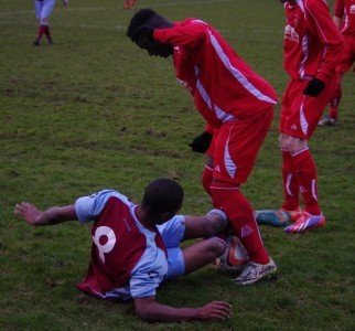 Grounded Doran Jordan attempts to tackle Kadan Fishley