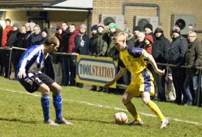 Tadcaster Albion striker David Brown looks to take on Aquaforce's Gary Stohrer. Picture: Ian Parker