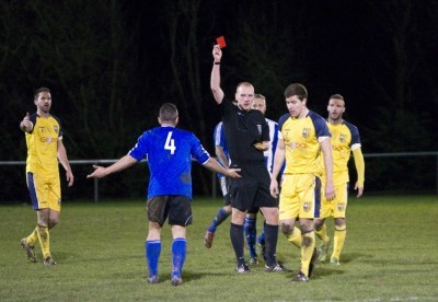 Referee Christopher Akers shows Shaw Lane midfielder Steve Istead his red card in a controversial second half