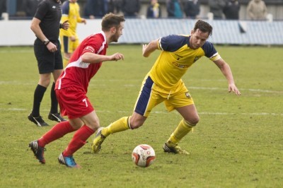 Captain Steve Woolley looks to shrug off Tadcaster's former Handsworth and Parramore midfielder Danny Patterson
