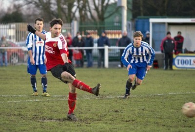 Knaresborough Town striker Mitch Hamilton strikes his penalty which was saved Yorkshire Amateur goalkeeper Suwara Bojang