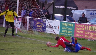 Ben Parkes and Carl Heard crash to the ground before the penalty is given