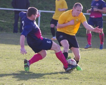 New Penistone signing Dale Kelly goes in hard on Shaw Lane defender James Cotterill during days at Nostell 