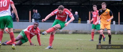 Steve Bromley slots home the winner for Harrogate Railway in the 2-1 victory at New Mills