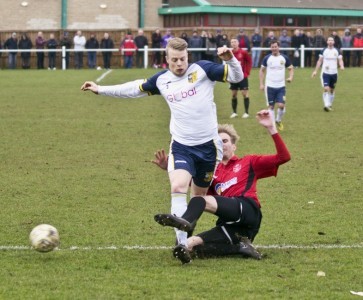Josh Barrett's progress is halted by a Highworth defender. Picture: Ian Parker