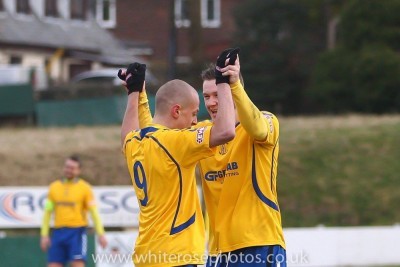Hat-trick hero Brad Grayson (left) celebrates scoring in Stocksbridge's emphatic 5-0 win over Market Drayton Town. Picture: White Rose Photos