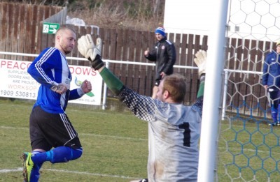 Lee Morris looks at the net after scoring his second penalty