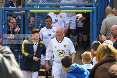 Former Leeds United captain Brendan Ormsby leads the teams out with his son Liam. Picture: whiterosephotos.co.uk