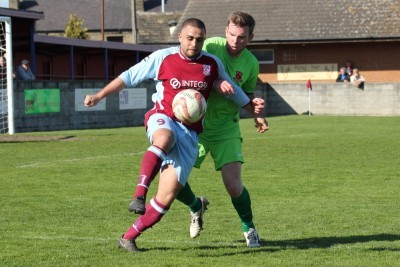 Ash Flynn holds onto the ball for AFC Emley. Picture: Mark Parson