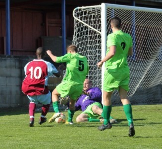 Stand-in Selby Town goalkeeper Dave Ricardo races out and stops Doran Jordan in his tracks. Picture: Mark Parsons