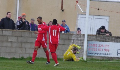 Joel Hughes celebrates scoring the opening goal for Yorkshire Amateur