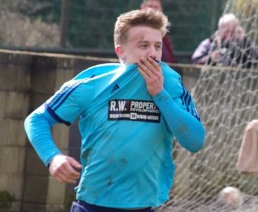 Glory moment: Nick Guest kisses the Hemsworth badge after scoring the third goal in the GroundHop weekend demolition of AFC Emley