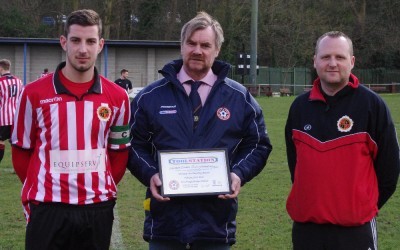 NCEL representative Karl Blackburn presents Worsbrough captain Danny Cawley and chairman Jonathan Cotterill-Bolsover with their Fair Play League award for February