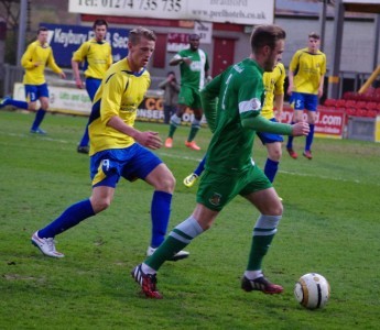 Garforth striker Nick Black shadows Sam Patterson