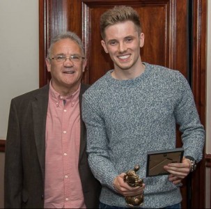 Ossett Town manager John Reed presents Brad Dixon with the players' player of the year trophy. Picture: Mark Gledhill