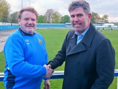 Staveley chairman Terry Damms welcomes Brett Marhall (right) to the club