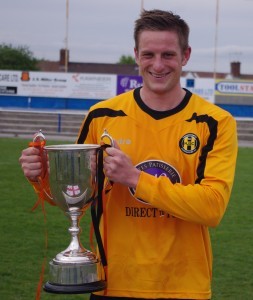 Handsworth midfielder Luke Fletcher with the NCEL League Cup trophy