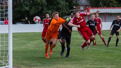 The smallest player on the pitch, Josh Whiteley, heads Ossett ahead. Picture: Mark Gledhill