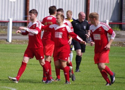 New Selby striker Kingsley Wetherald congratulates Jack Binns after the first goal