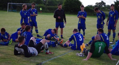 Paul Marshall talks to his Pickering Town players during the interval